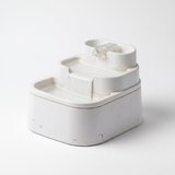 A typical plastic cat fountain