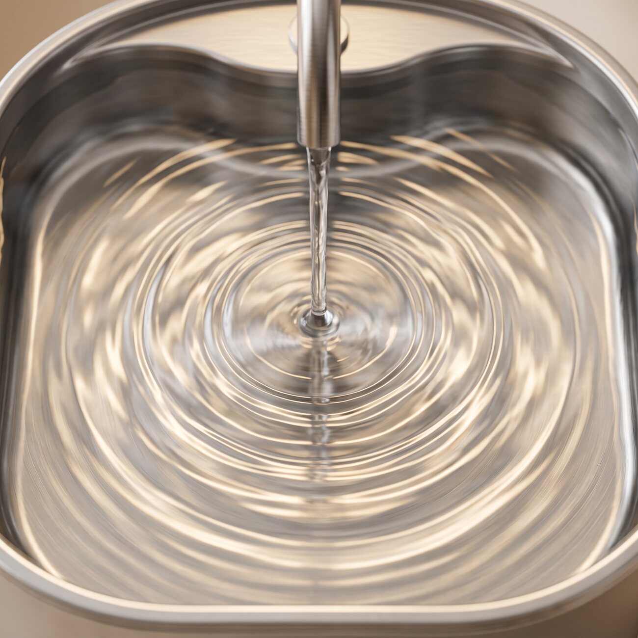 Macro close-up of clean moving water rippling in the GentleFlow fountain basin